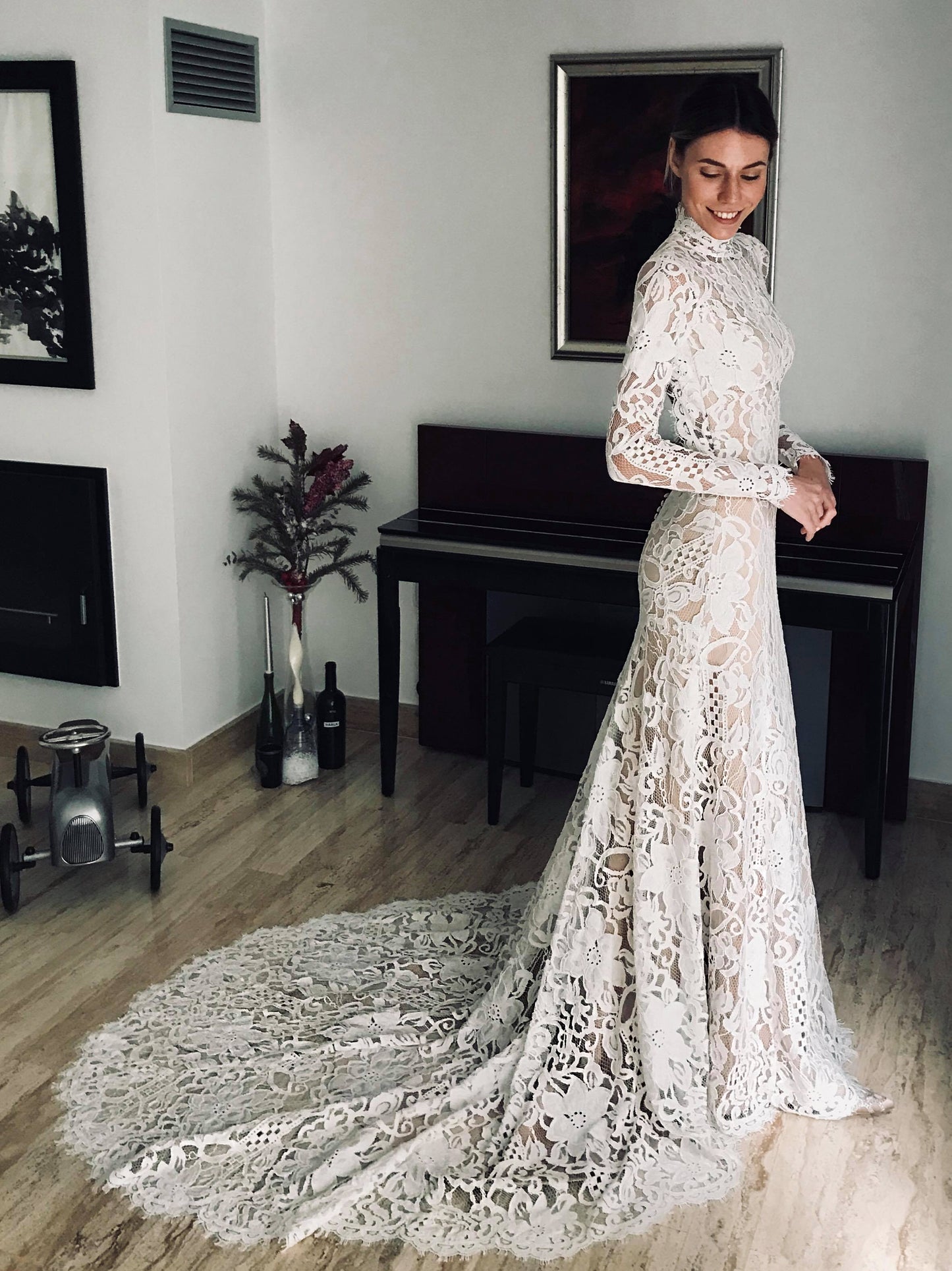 Bohemian lace wedding dress with turtleneck, open back and long sleevess.