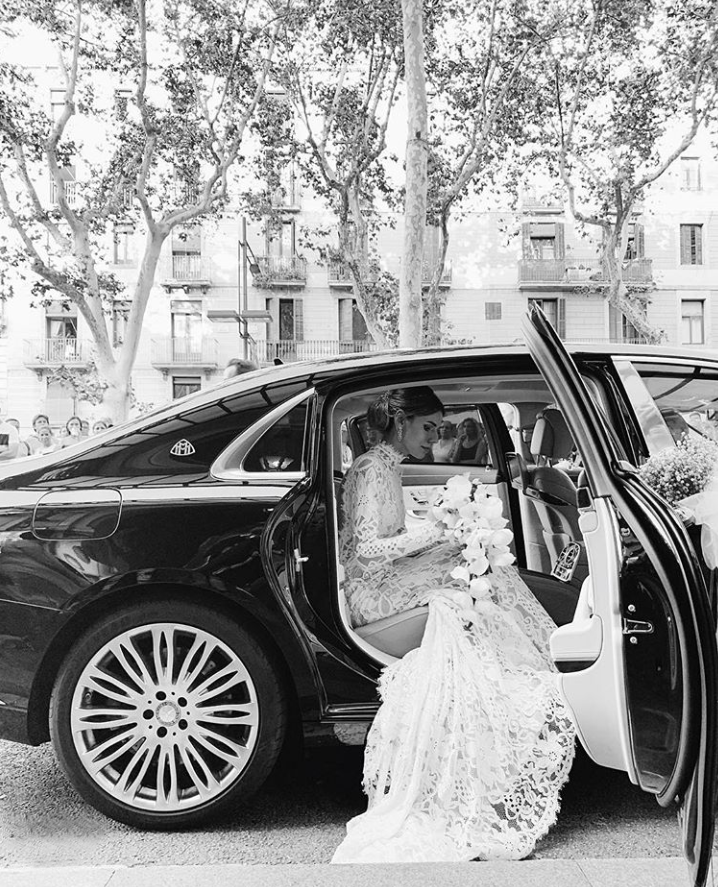 Bohemian lace wedding dress with turtleneck, open back and long sleevess.