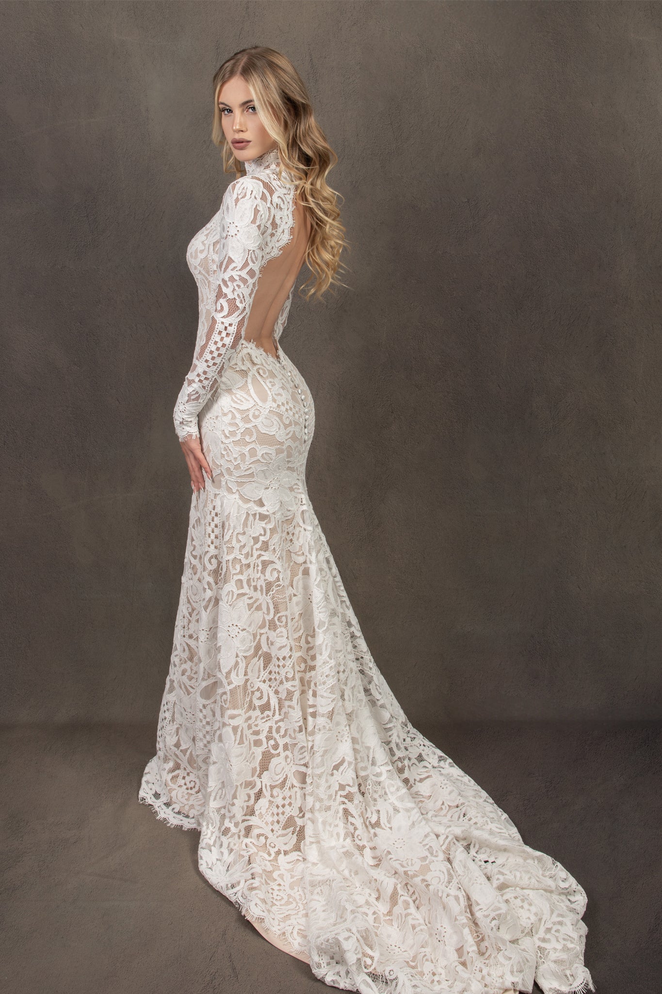 Bohemian lace wedding dress with turtleneck, open back and long sleevess.