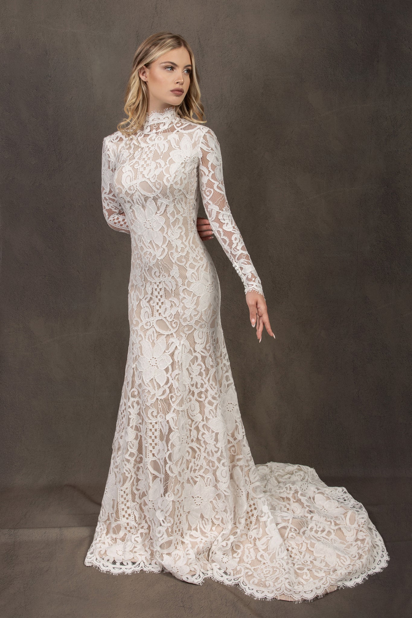 Bohemian lace wedding dress with turtleneck, open back and long sleevess.