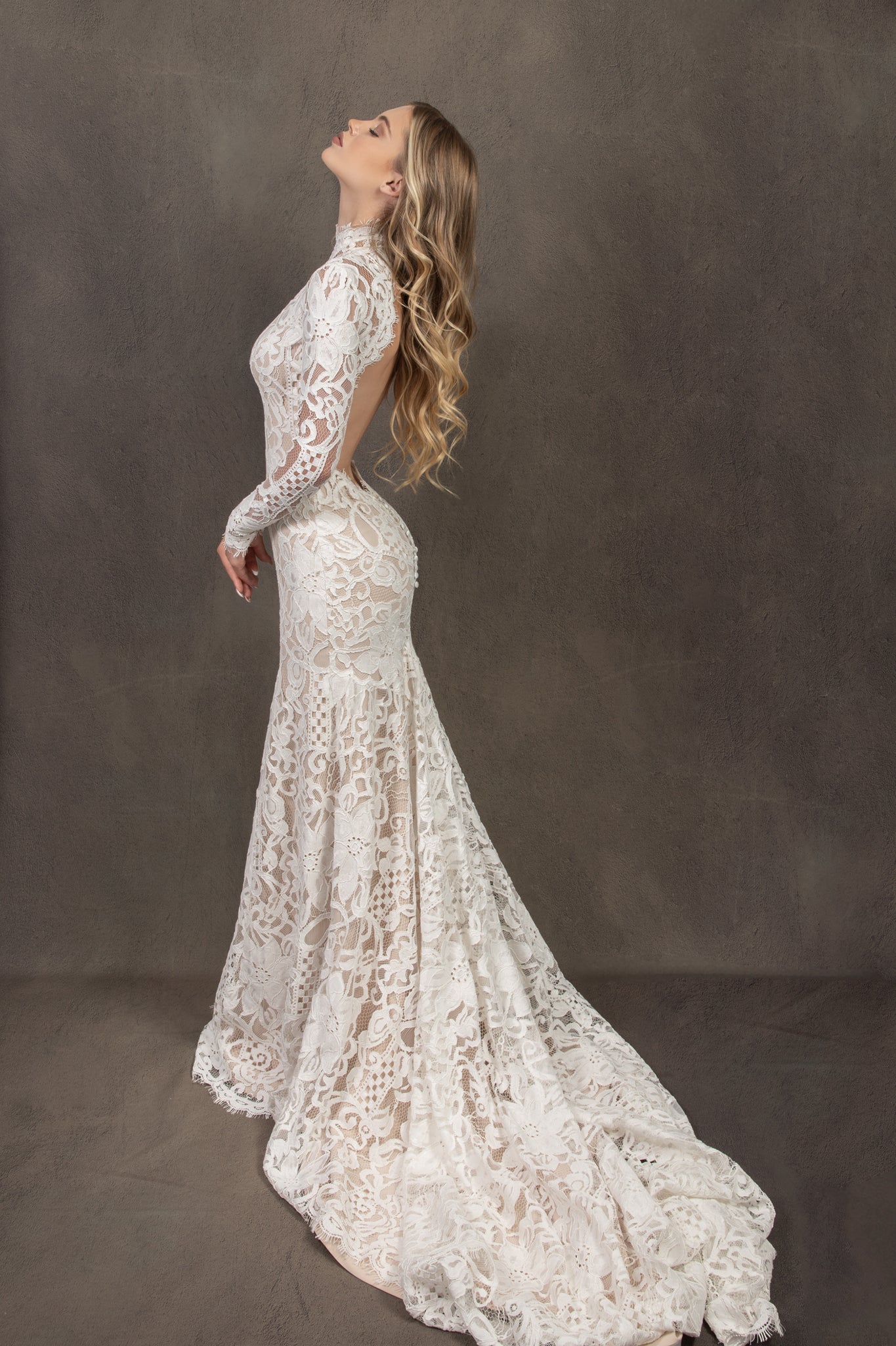 Bohemian lace wedding dress with turtleneck, open back and long sleevess.
