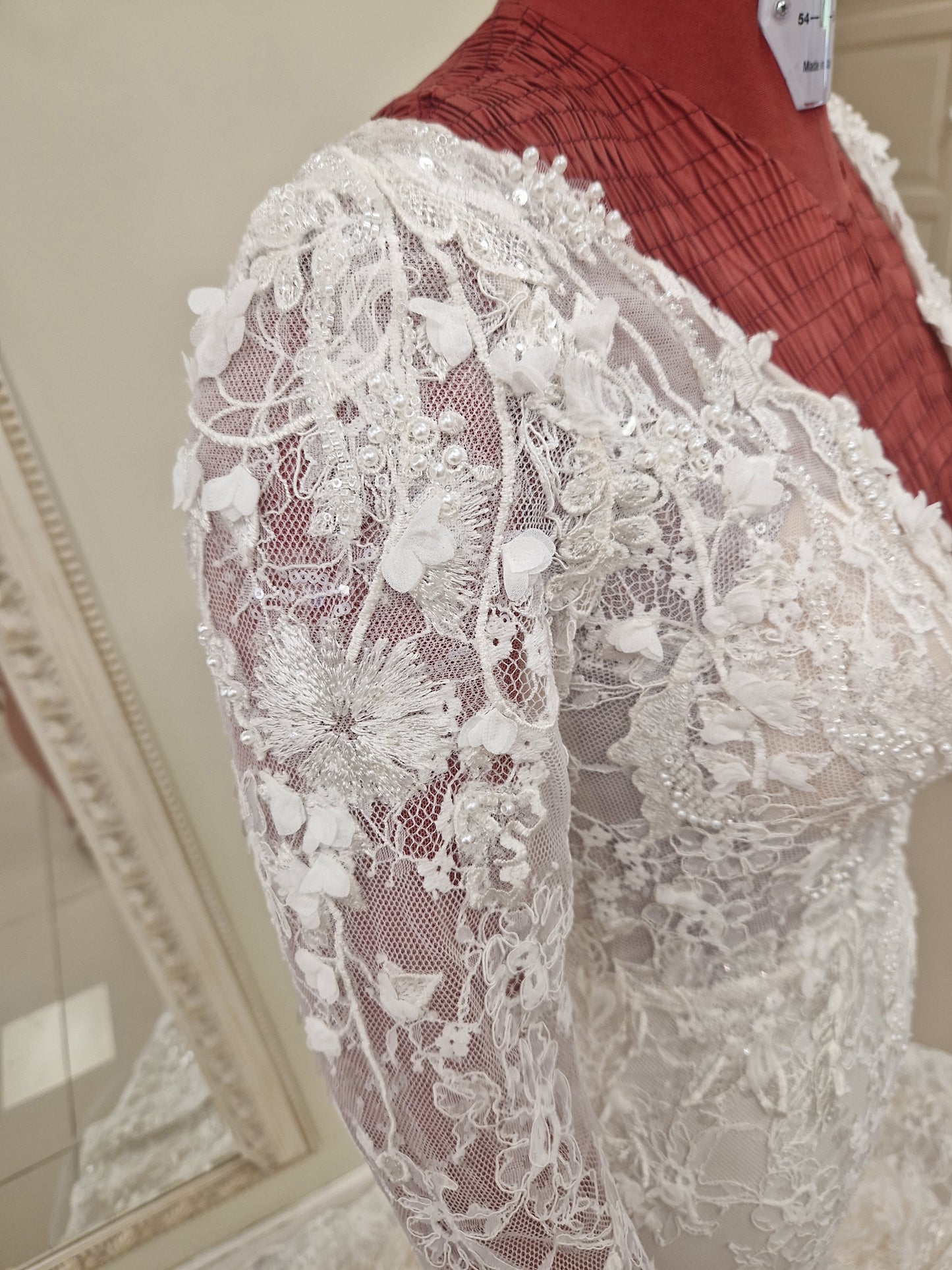 Detail at the shoulder of the Amara gown - hand attached lace appliques with lots of beading, sequins and pearls.